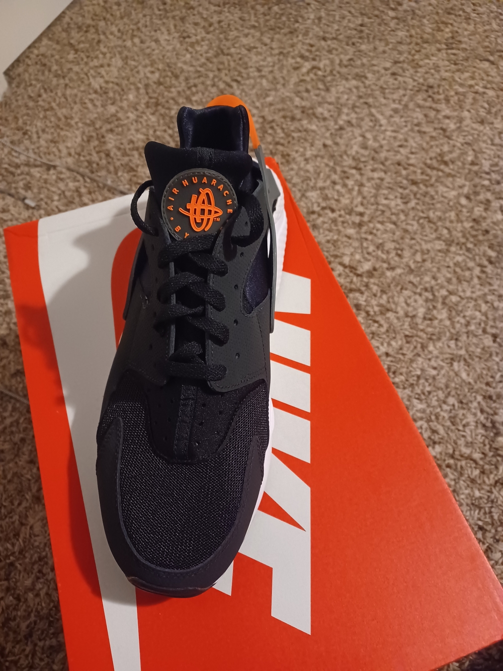 Nike Black Sneaker with Orange Logo Accent